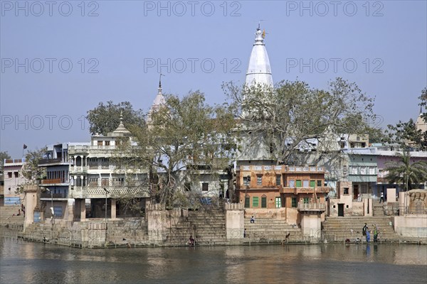 People washing on the shore of lake Manasi-Ganga at the village of Govardhan, Uttar Pradesh, India,