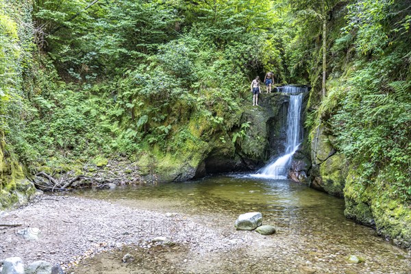 Teenagers swimming at the Geroldsau waterfall, Geroldsau, Baden-Baden, Baden-Württemberg, Germany,