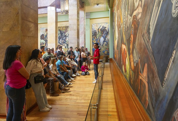 People viewing 'Katharsis' 1934 mural by Jose Clemente Orozco, Palacio de Bellas Artes, Palace of