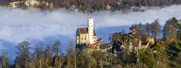 Sunshine in the mountains, fog in the Echaz valley. Lichtenstein Castle in the Swabian Alb. The