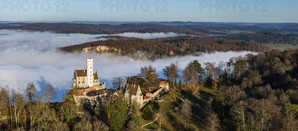 Sunshine in the mountains, fog in the Echaz valley. Lichtenstein Castle in the Swabian Alb. The