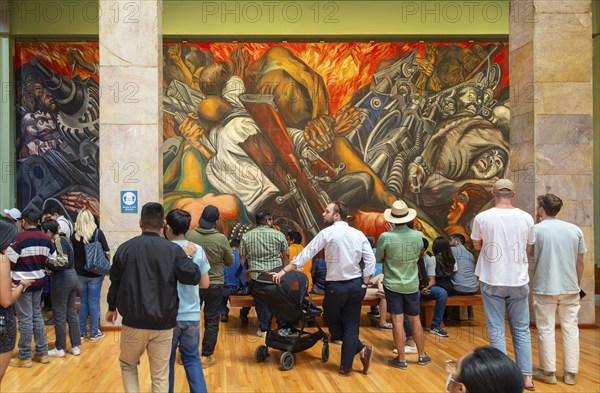 People viewing 'Katharsis' 1934 mural by Jose Clemente Orozco, Palacio de Bellas Artes, Palace of