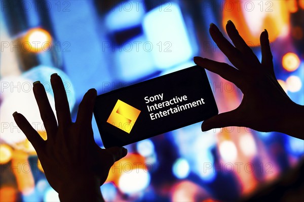 In this photo illustration, the Sony Interactive Entertainment (SIE) logo is displayed on a