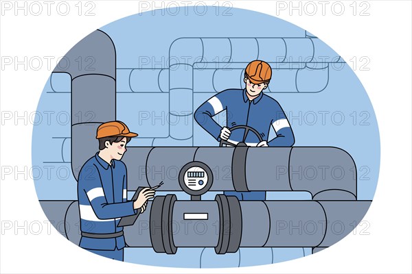 Male workers in uniform inspect and maintain water tubes and pipes. Mechanics control pipeline