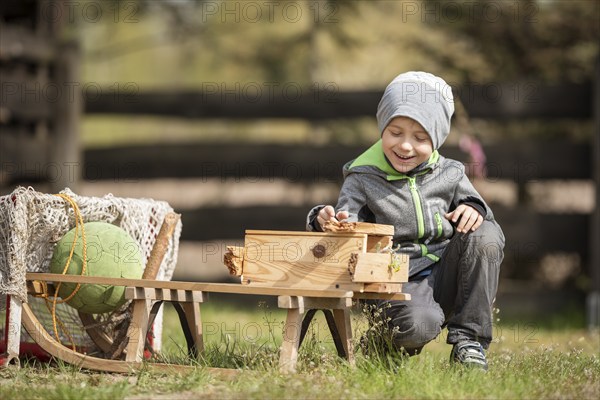 Smiling 6 years old boy playing aoutdoor
