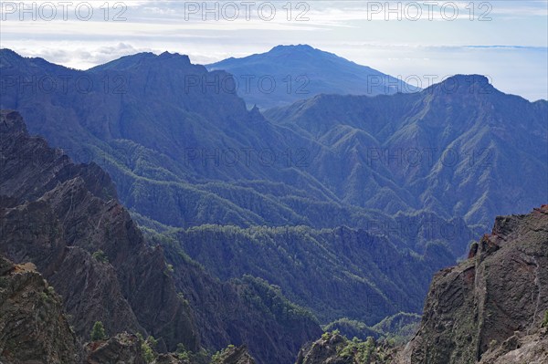 Rugged mountains stretch out under a cloudy sky, Caldera de Taburiente, Roques de los Muchachos, La