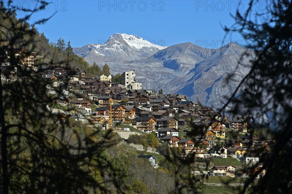 The village of Hérémence with the striking concrete church of St Nicolas, Hérémence, Hérens Valley,