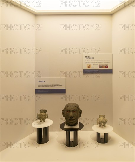 Carved stone head and tripod jars, archaeological site and museum of Templo Mayor, Mexico City,