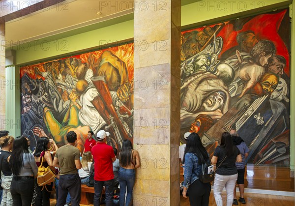 People viewing 'Katharsis' 1934 mural by Jose Clemente Orozco, Palacio de Bellas Artes, Palace of