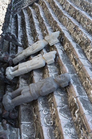 Stone Aztec statues on temple steps, archaeological site and museum of Templo Mayor, Mexico City,
