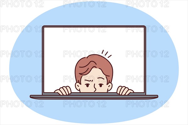 Man with frightened face looks out of laptop screen for concept of non-professional work on