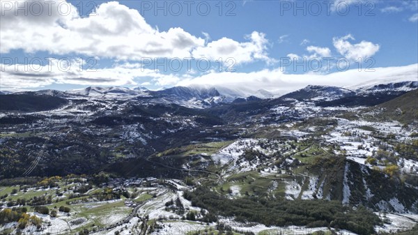 Expansive mountain landscape with snow-covered fields and a partly cloudy sky. Posof, Ardahan,
