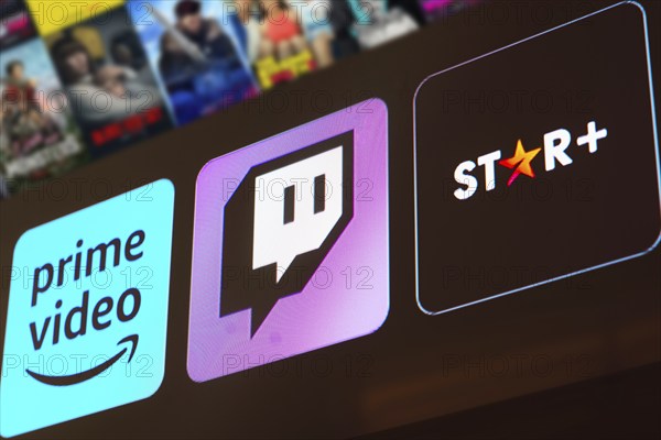 In this photo illustration the Amazon Prime Video, Twitch and Star Plus logo is displayed on a TV