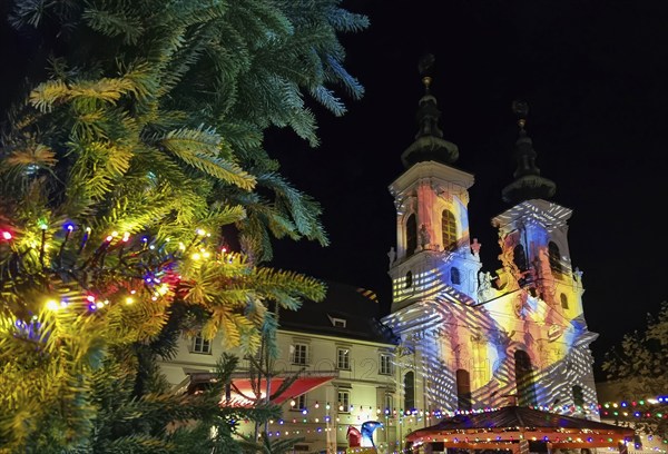 Beautiful Christmas decorations and Mariahilfer church, at night, in the city center of Graz,