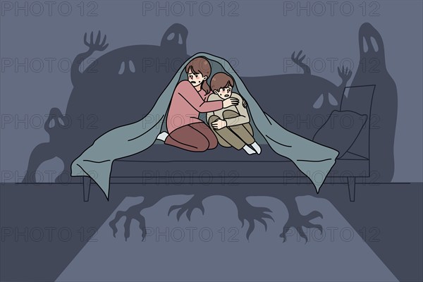 Scared small children sit on bed under blanket terrified by imaginary monsters. Frightened little