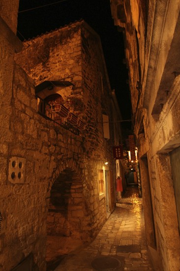 Little narrow mediterranean alley in downtown Trogir, Croatia, Europe