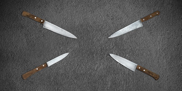 Topview of Set Cooking Knives on Dark Background