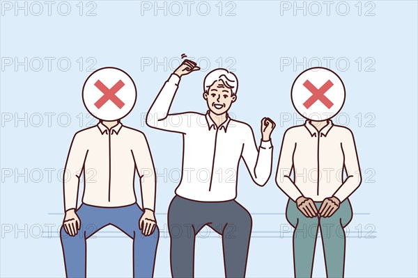 Experienced man candidate for vacancy rejoices at receiving job offer, sitting among rivals with