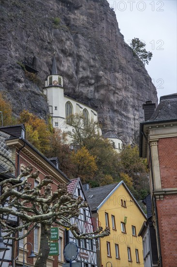 An old half-timbered town in autumn. A church was built into a rock here. Unique German