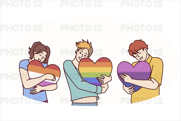 People hugging hearts painted in colors of LGBT and LGBTQ flags making freedom of choice in sex and