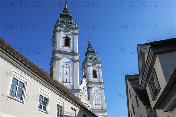 The two towers of the former collegiate church of St Peter, a Roman Catholic parish church, Bad