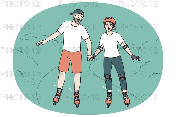 Happy mature couple have fun on roller blades on weekend in park. Overjoyed active energetic