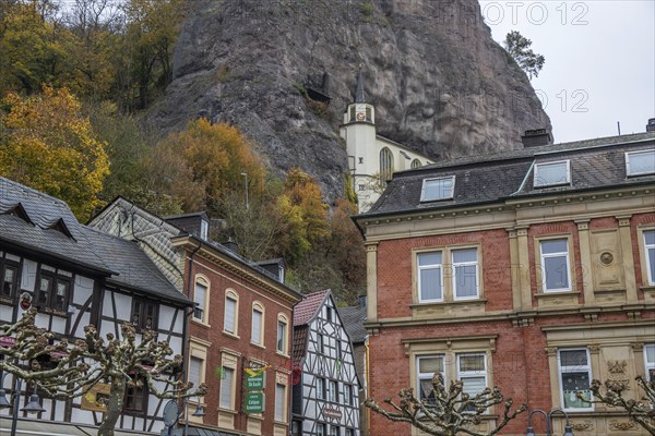 An old half-timbered town in autumn. A church was built into a rock here. Unique German