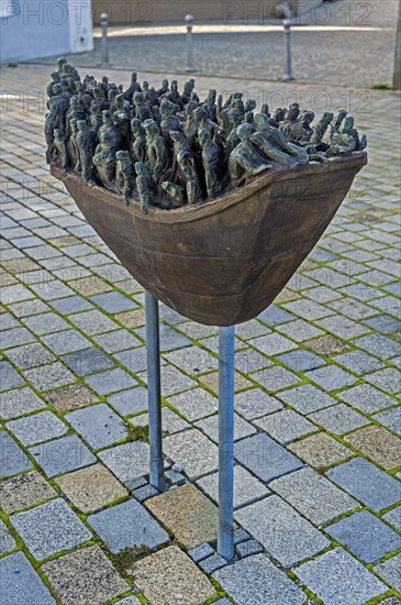 Figures in a boat, bronze artwork at the former collegiate church of St Peter, a Roman Catholic