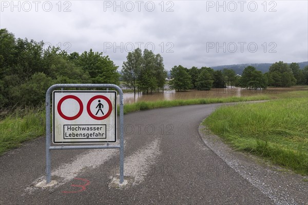 Symbolic image extreme weather, global warming, climate change, information board, flood retention