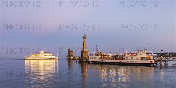 Excursion boat, the Imperia and restaurant on the historic ferry Constance in the harbour,