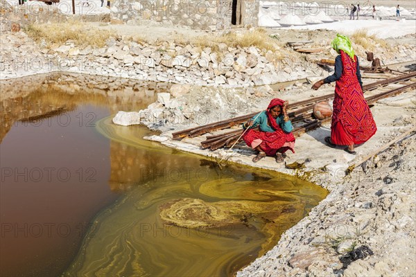 SAMBHAR, INDIA, NOVEMBER 19, 2012: Women mining salt at lake Sambhar, Rajasthan, India. Sambhar