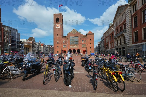 Amsterdam, Netherlands, May 7, 2017: Beursplein with parked bicycles motorcycles and Beurs van