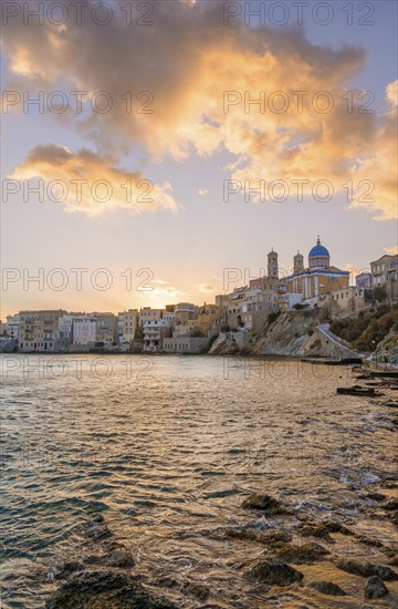 View of the village with the Greek Orthodox church of Agios Nikolaos, Asteria Beach, at sunset with
