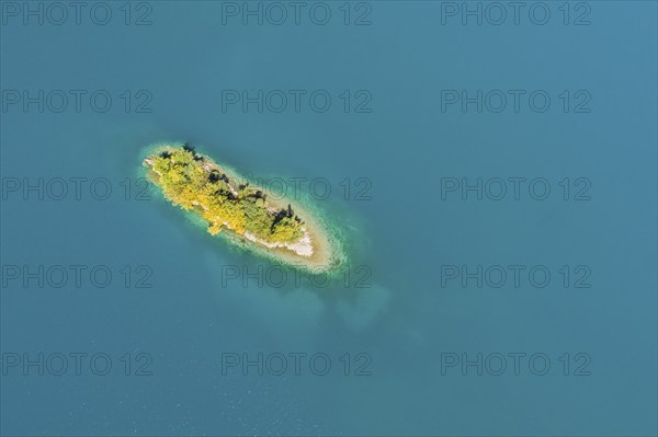 Bird's eye view of the chive island in the turquoise waters of Lake Walen in the canton of St.