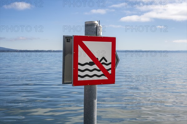 Prohibition sign with pictogram for bathing prohibition on the shore of Lake Constance, Canton