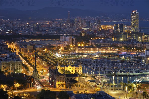 BARCELONA, SPAIN, APRIL 15, 2019: Aerial view of Barcelona city skyline with city traffic and port