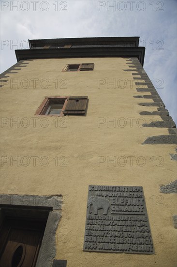 Historic cowherd's defence tower the elephant with view upwards and information board, fortified