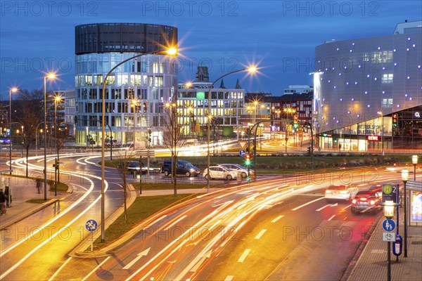 Evening city traffic in Essen, Germany, large intersection, roundabout, Berliner Platz, Berlin