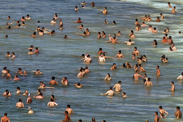 View from above of anonymous crowd on the beach, tourists swimming in the sea, enjoying cooling