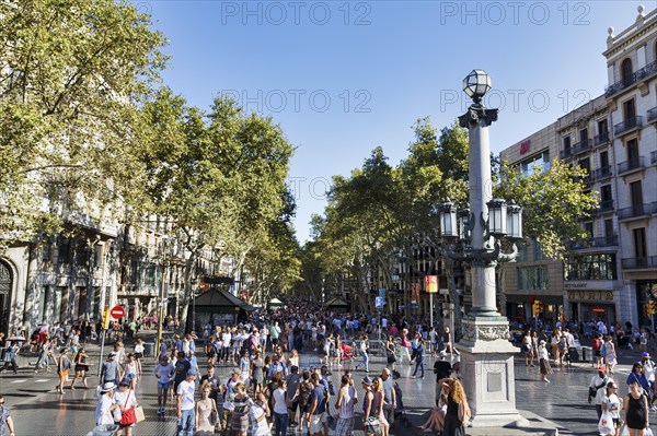 Crowd in summer, pedestrians and tourists in pedestrian zone La Rambla, Ramblas, old town,