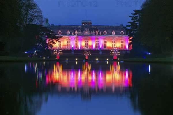 Illuminated Benrath Palace in the evening with the mirror pond at Christmas Wunderwelt, Düsseldorf,