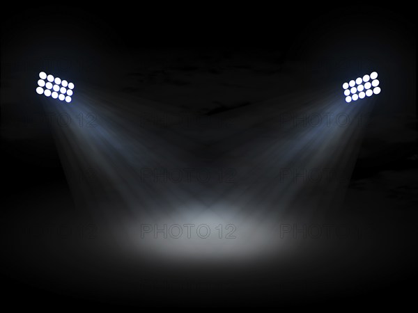 Stadium theater floolights spotlights with light beams on black background