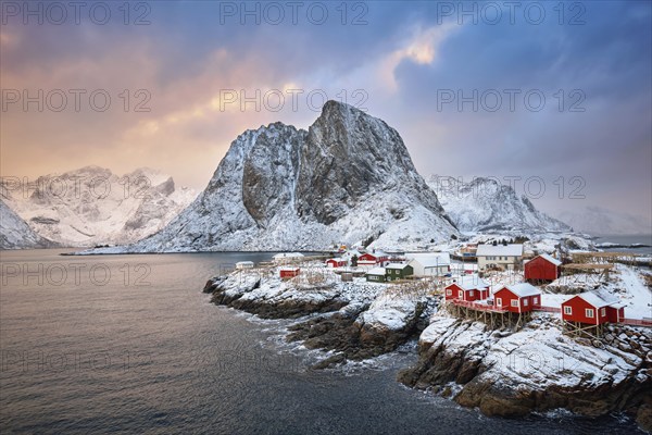 Famous tourist attraction Hamnoy fishing village on Lofoten Islands, Norway with red rorbu houses.