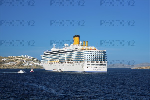 MYKONOS, GREECE, MAY 29, 2019: Cruise liner ship Costa Luminosa in Mediterranea sea near Mykonos