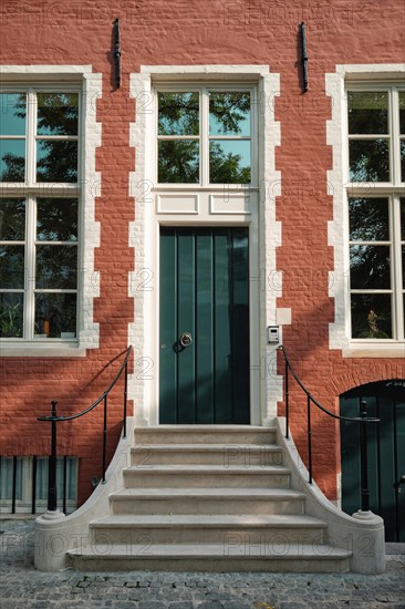 Brugge door with doorstep and window of an old Eurupean house. Bruges, Belgium, Europe