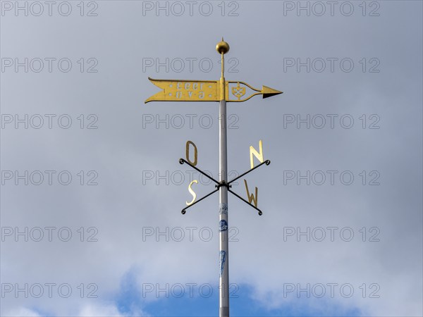 Metal wind arrow and wind chime for indicating cardinal points, north, south, east, west, Germany,