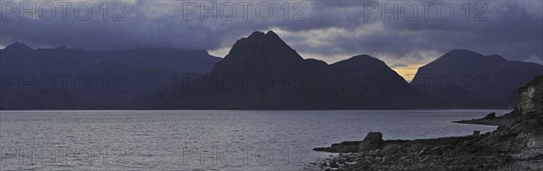 Rain clouds at sunset over the Cuillin Hills, viewed from Elgol on the Island Skye, Inner Hebrides,