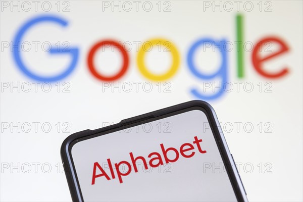 Google and Alphabet logo of the computer hardware software and search engine producer on a mobile