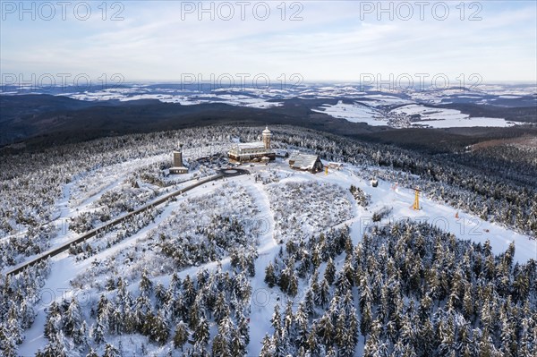 Fichtelberg highest mountain in the Ore Mountains in winter aerial view in Oberwiesenthal, Germany,