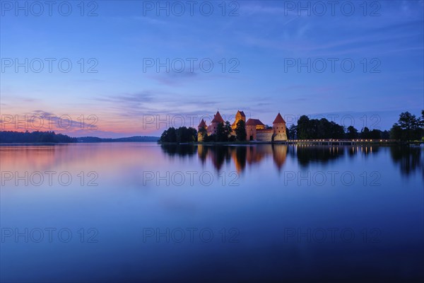 Trakai Island Castle in lake Galve illuminated in night, Lithuania, Europe